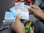 Bukti penarikan uang dari ATM.