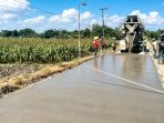 IMG-20260720-WA0009 Kondisi terkini jalan rigid beton sepanjang 426 meter di Desa Banggle, Lengkong, Nganjuk, pasca rampung dikerjakan oleh Dinas PUPR.