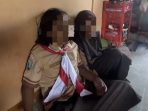 Dua anak yang hendak menjadi korban pencurian anting dengan modus ukur seragam di Sidoarjo. (Foto: Ist)