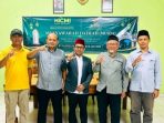 Muhammad Roissudin (tengah), berfoto bersama Ketua Demisioner Juwahir (kiri) dan jajaran formatur terpilih usai ditetapkan secara aklamasi sebagai Ketua Umum ICMI Orda Nganjuk periode 2026-2030.
