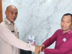 Penyerahan QRIS bantuan gempa NTT kepada Pj. Sekda Jember Achmad Imam Fauzi. (Foto: Ist)