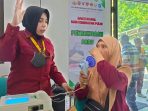 Pengobatan gratis kepada warga desa.